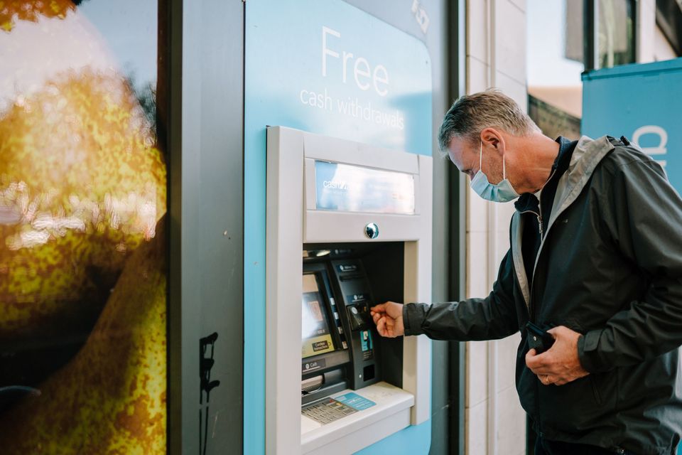 A man using an ATM